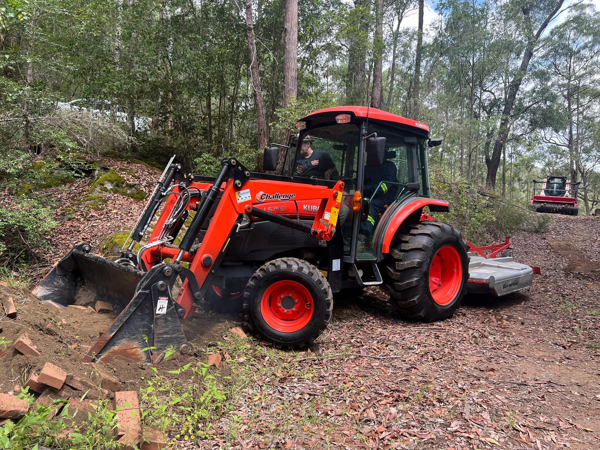Traccorp tractor and slasher working a fire trail